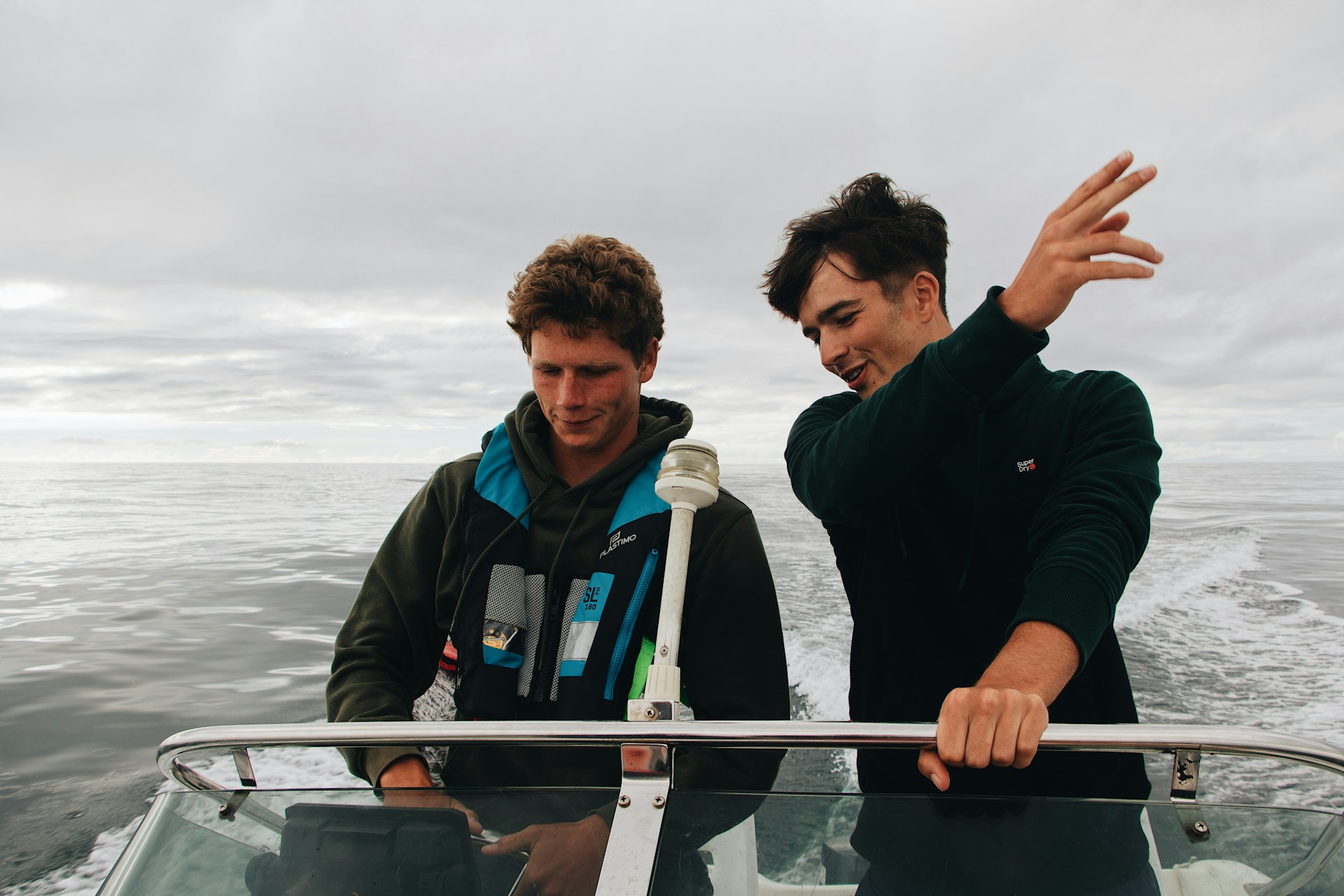 man in black jacket standing beside man in black jacket