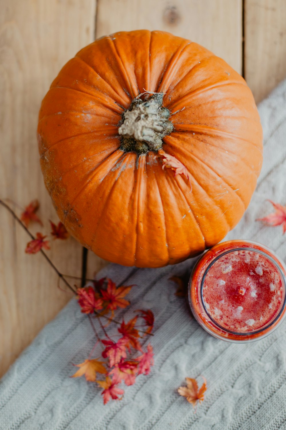 orange pumpkin on white textile