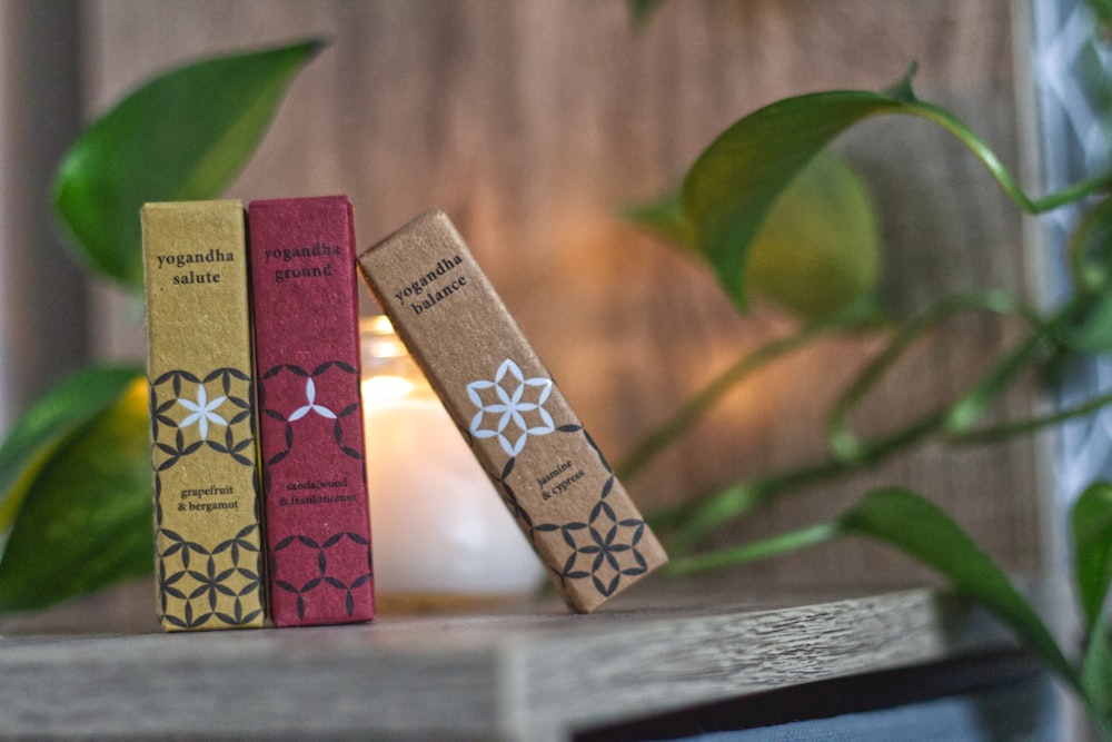 four assorted books on brown wooden table