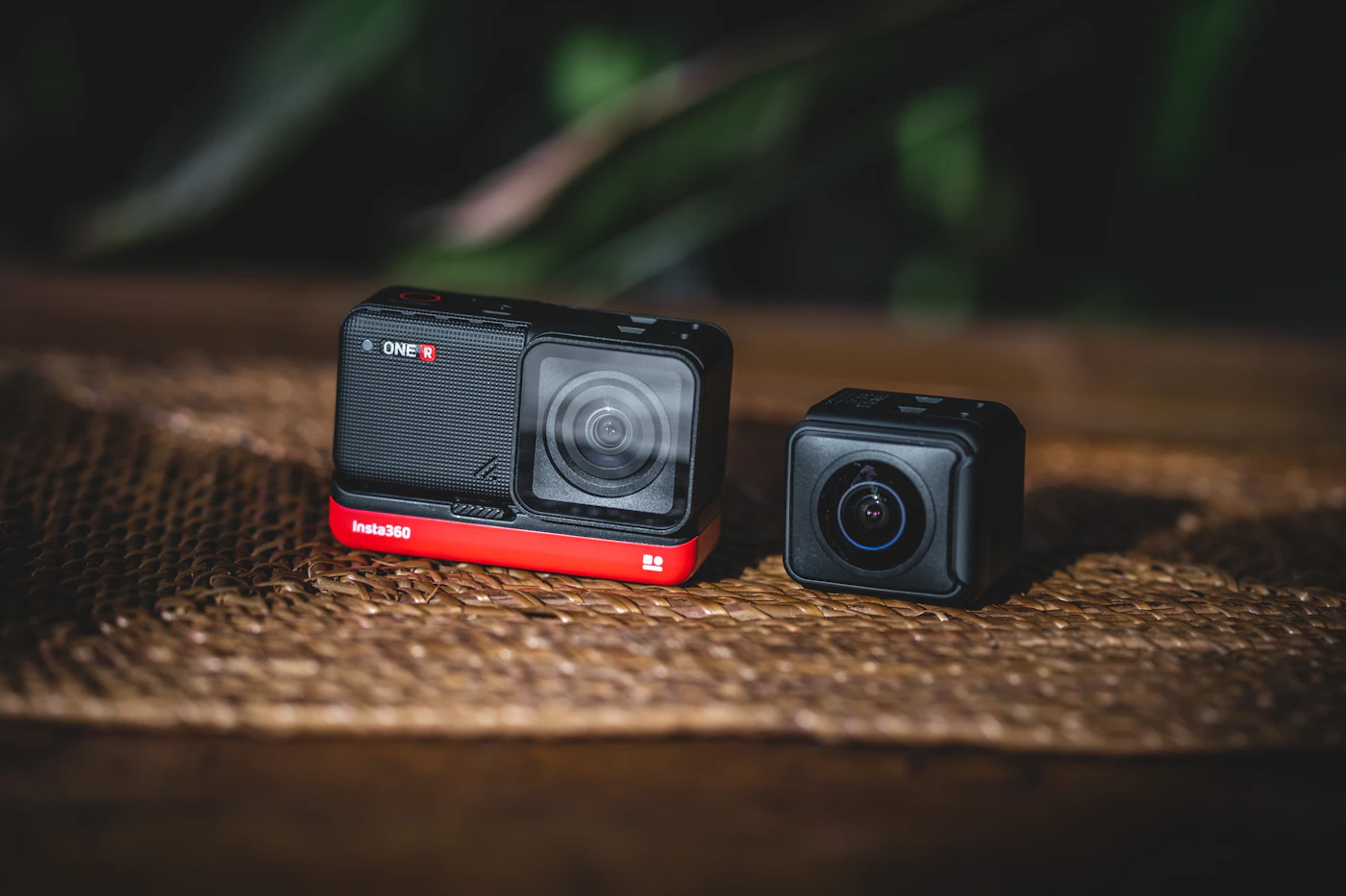 Insta360 One R action camera with modular lens on a wooden table
