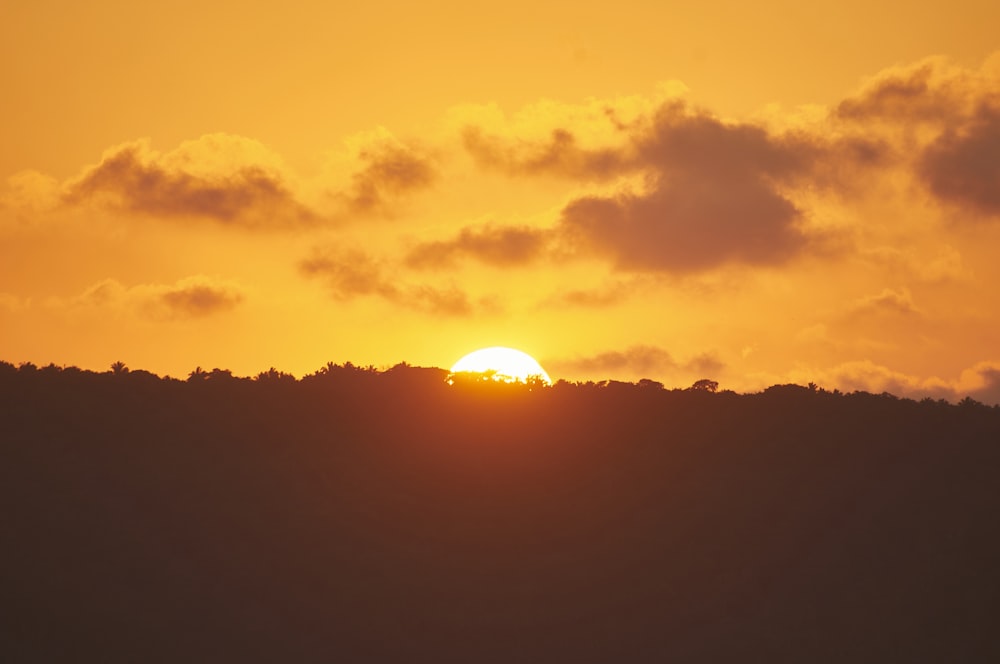 silhouette of mountain during sunset