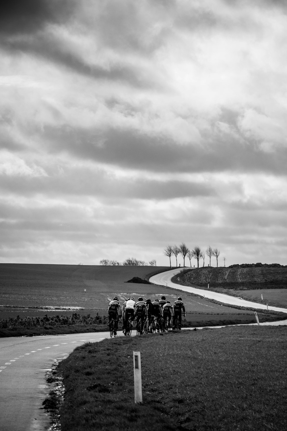 grayscale photo of people walking on road