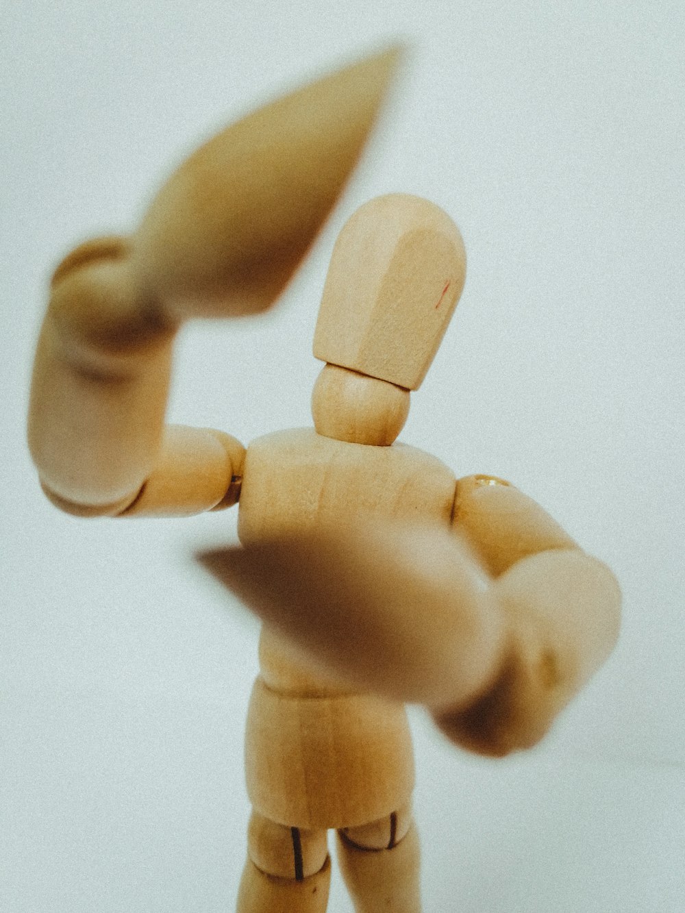 brown wooden human form with white background