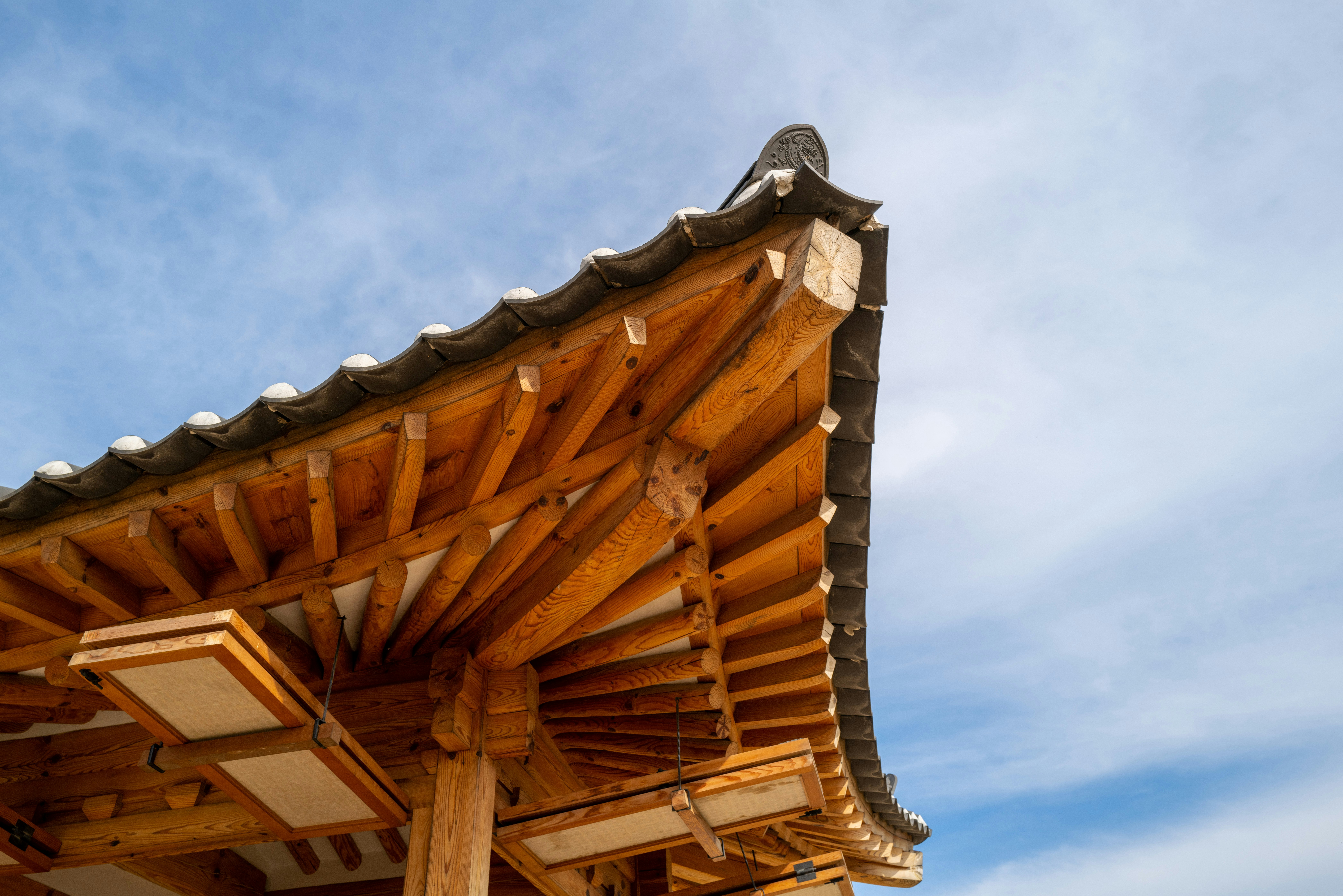 brown wooden roof under blue sky during daytime