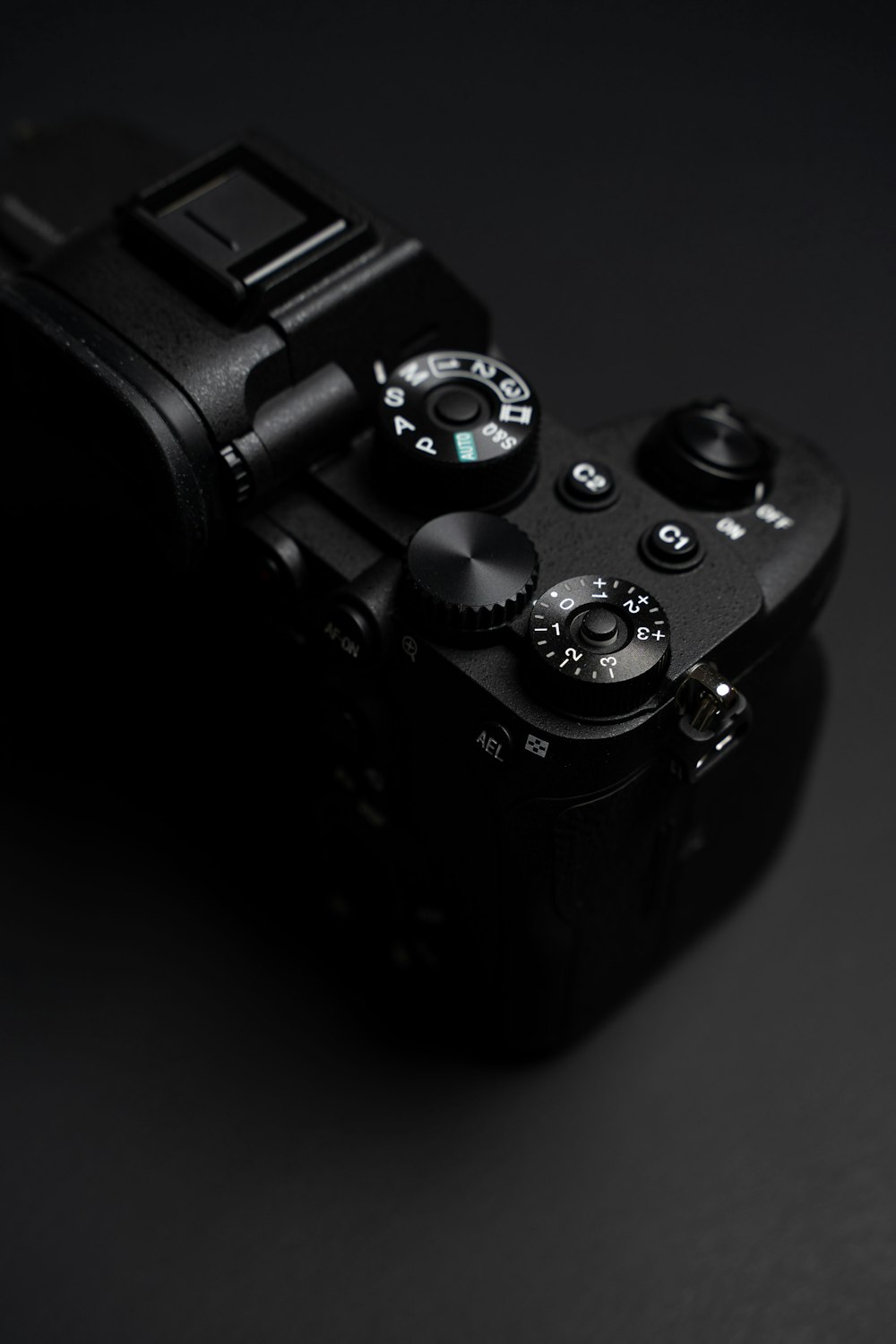 black dslr camera with water droplets