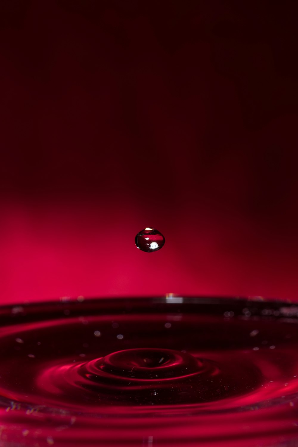 water droplets on red surface