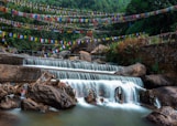 water falls with multi colored rope