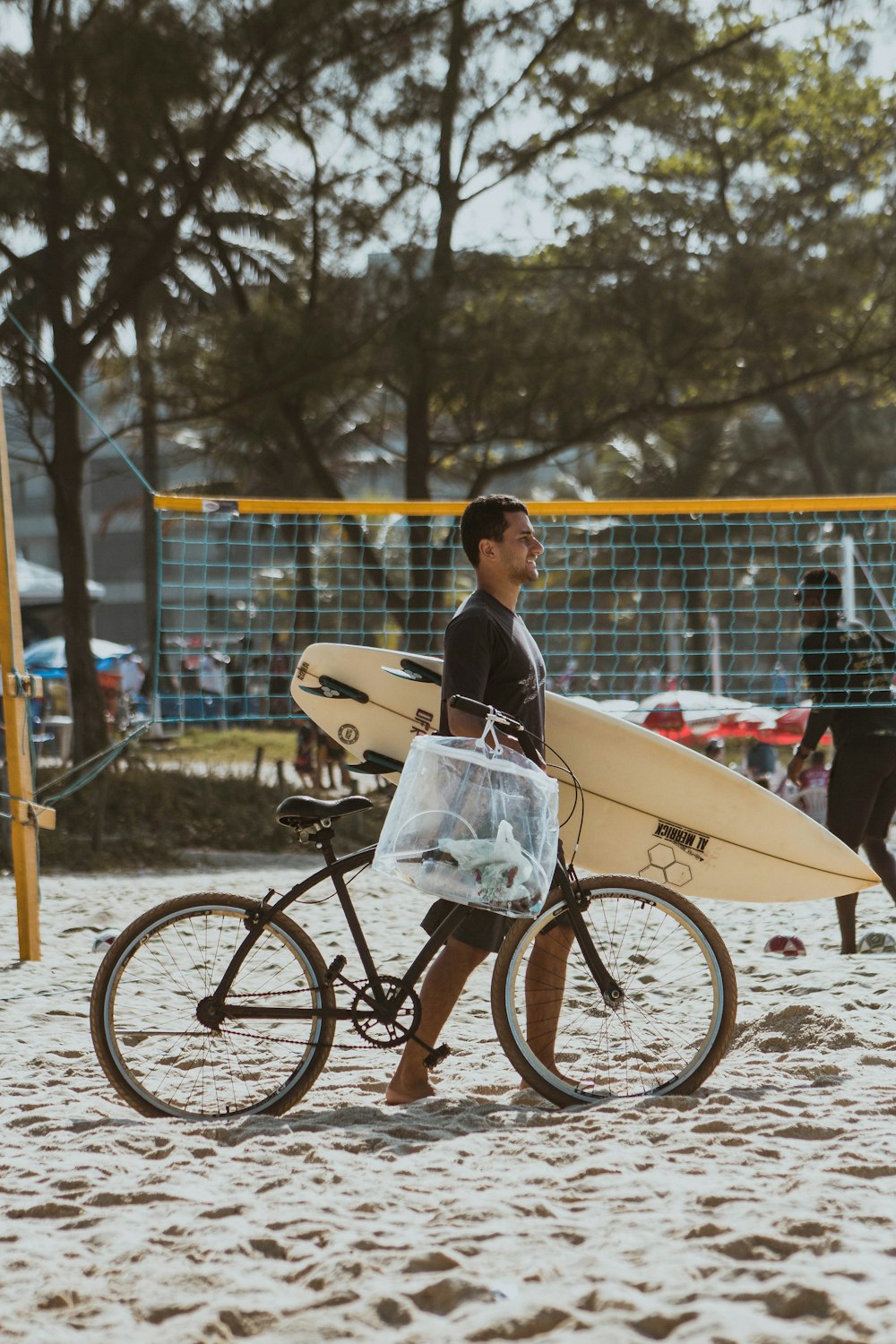 woman in white shirt riding on bicycle during daytime