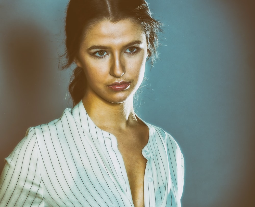 woman in white and black striped shirt