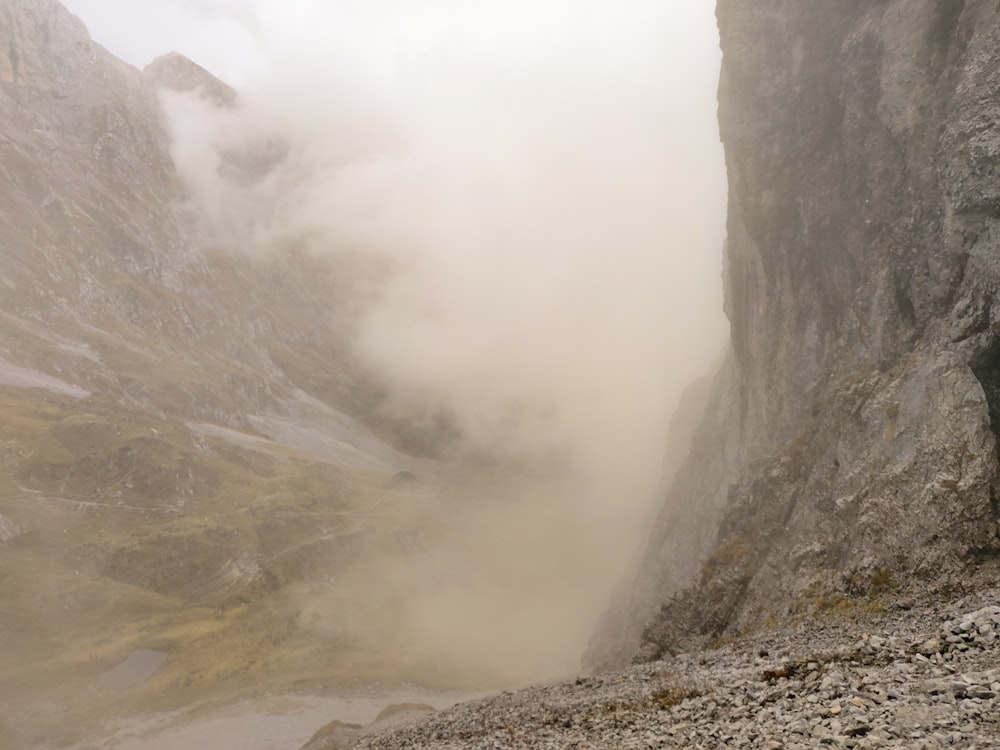 gray rocky mountain with fog