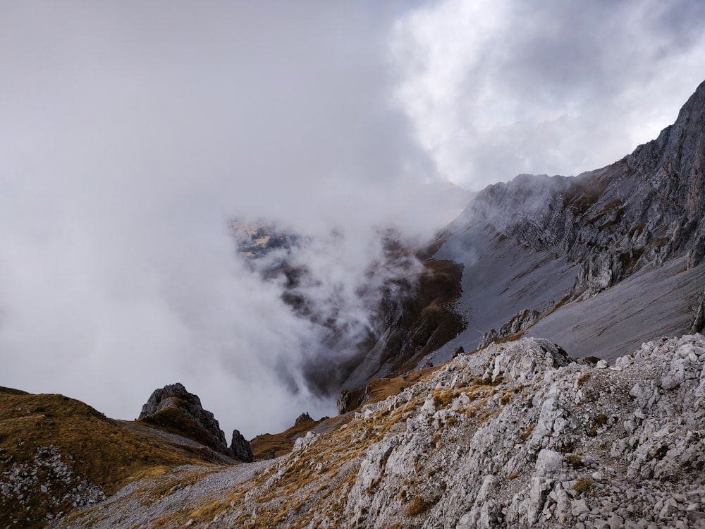 gray and white mountain under white clouds during daytime