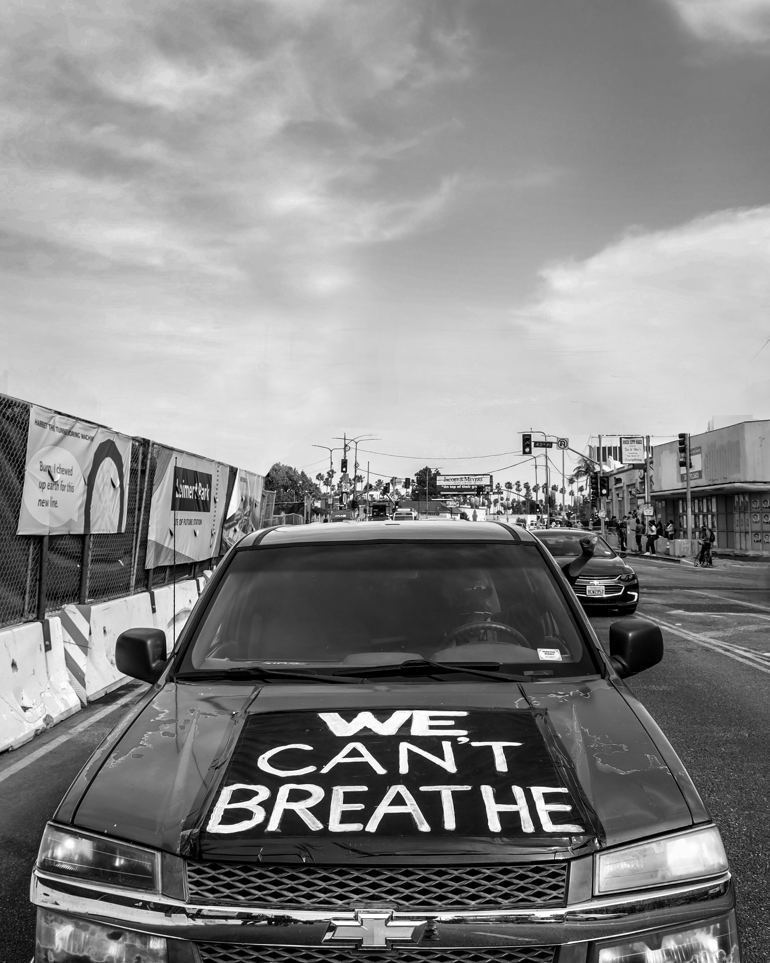 grayscale photo of car on road