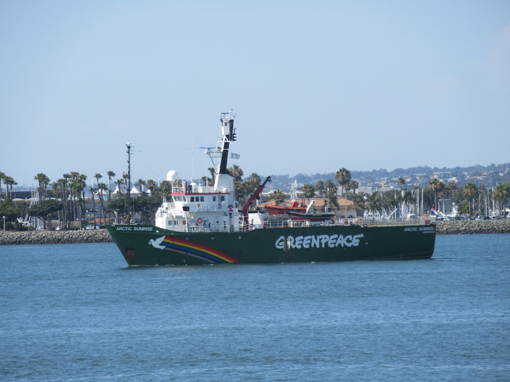 black and white ship on sea under white sky during daytime