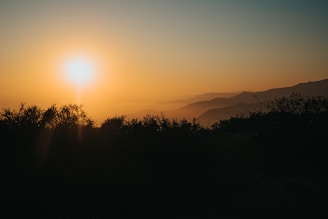 A serene sunset over the Negev mountains, symbolizing peace and reflection.