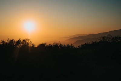 A serene sunset over the Negev mountains, symbolizing peace and reflection.