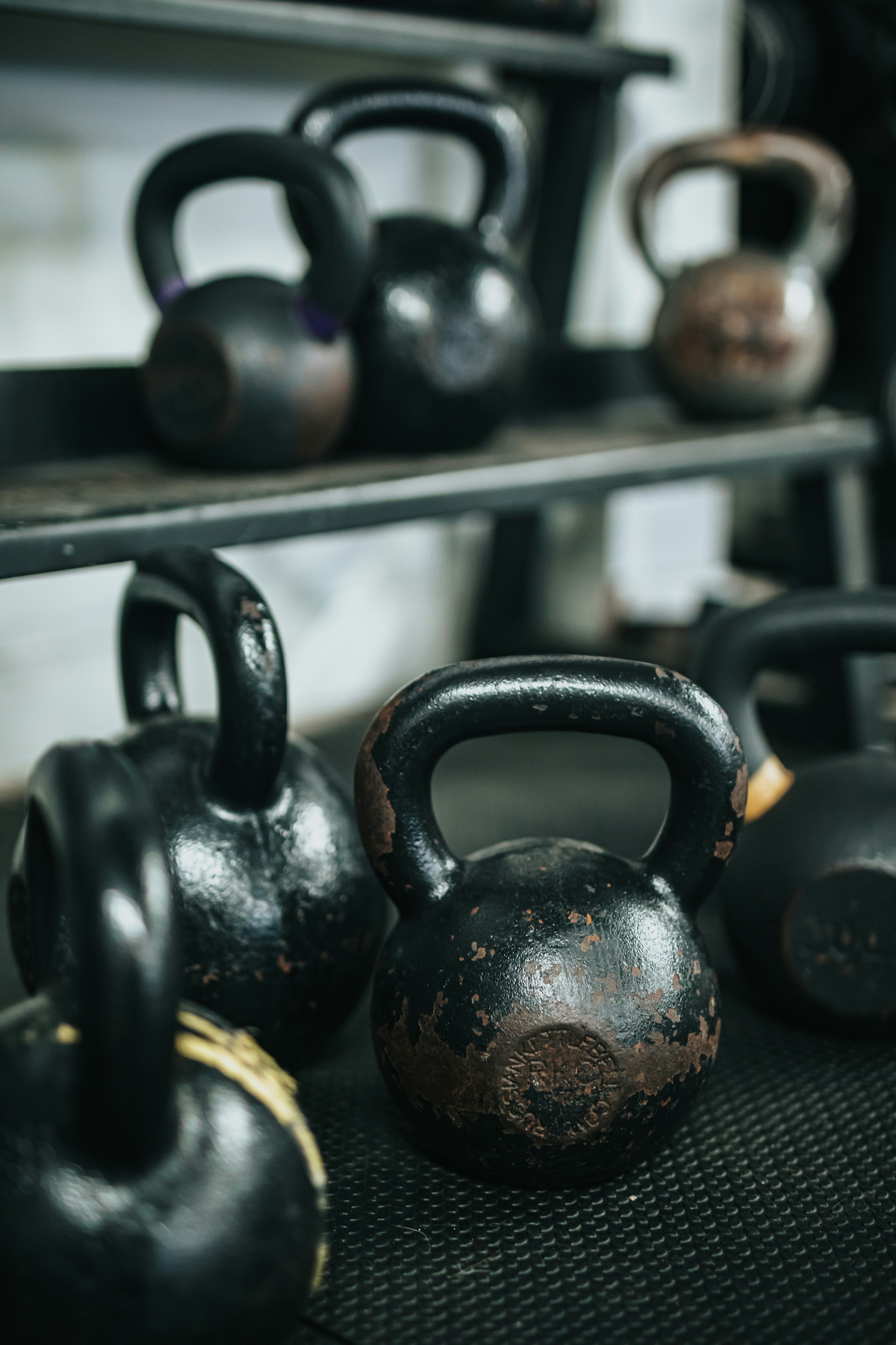 Matte black kettlebell set arranged elegantly