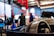 A close-up of industrial equipment being inspected by a technician in a workshop.