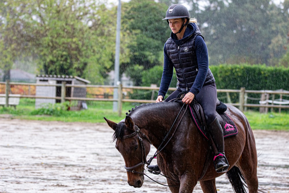 man riding horse during daytime