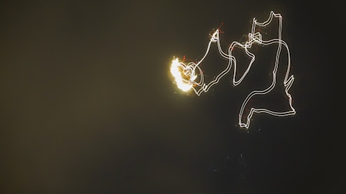 Abstract creative background showing animated cursor trail with faint magnifying glass effect.