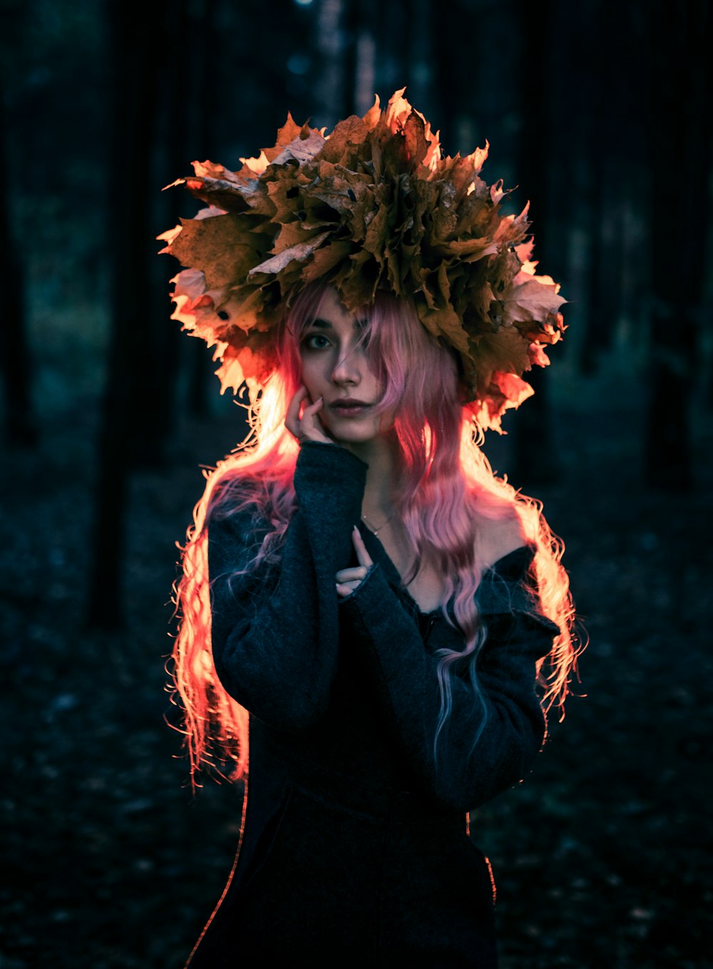 woman in black blazer with brown floral headdress