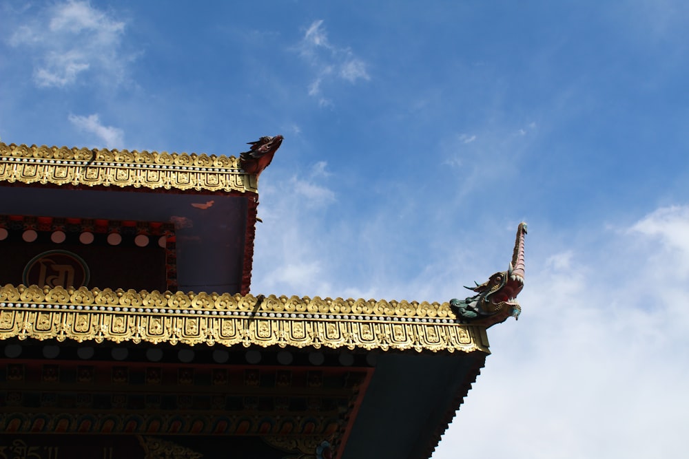 brown and red concrete building under blue sky during daytime