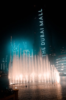 water fountain in the city during night time