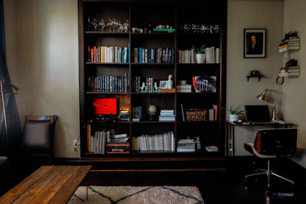 A relaxing home nook with soft lighting and neatly arranged gadgets and books.