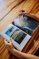 person holding white printer paper