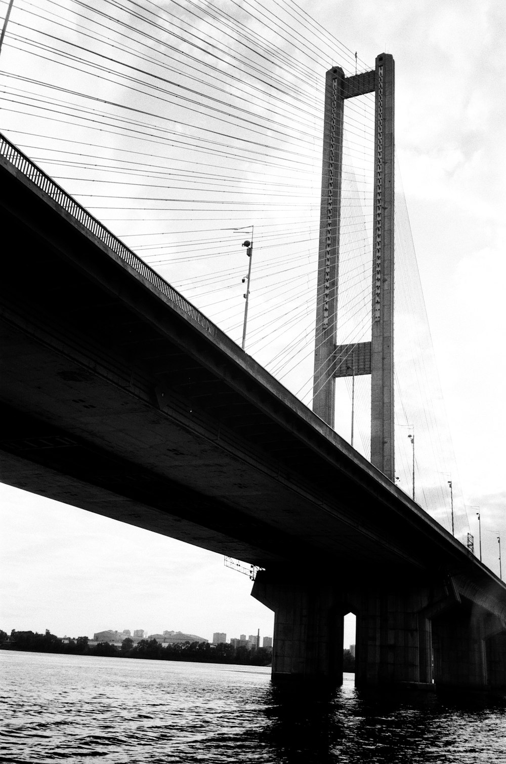 gray metal bridge under white sky during daytime