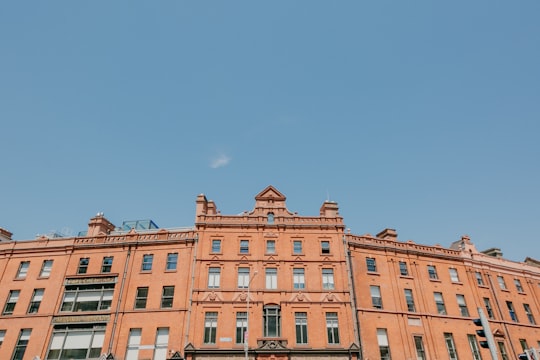 brown concrete building under blue sky during daytime in The Lincoln's Inn Ireland