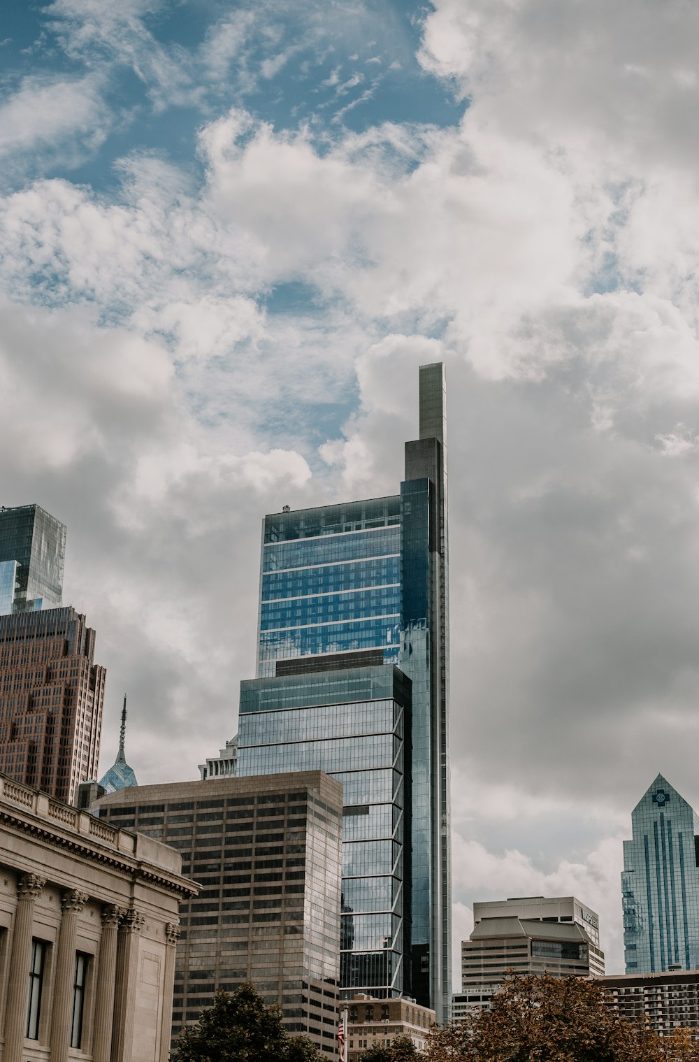 gray concrete building under cloudy sky during daytime