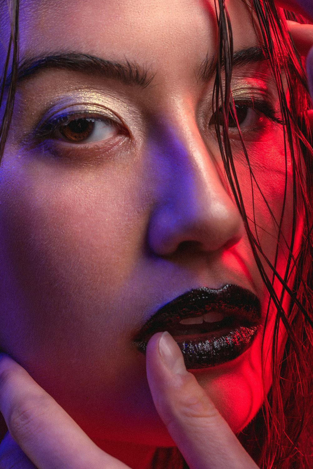 woman with red lipstick and purple eyes