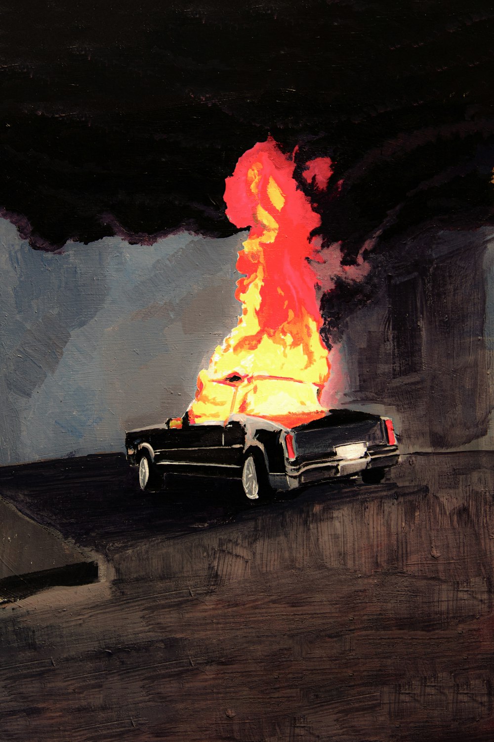 black chevrolet camaro on fire