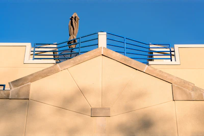 Modern beige awning over a villa terrace blending with earth tone surroundings.