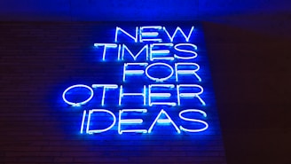 blue and white happy new year neon light signage