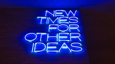 blue and white happy new year neon light signage