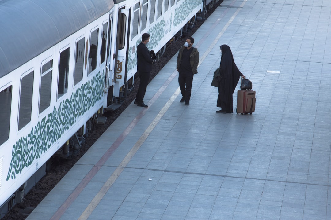 people walking on white floor tiles