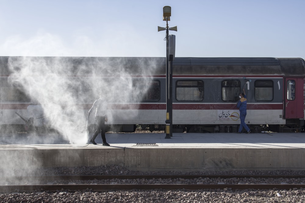 red and black train on rail tracks