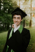 man in black academic gown