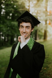 man in black academic gown