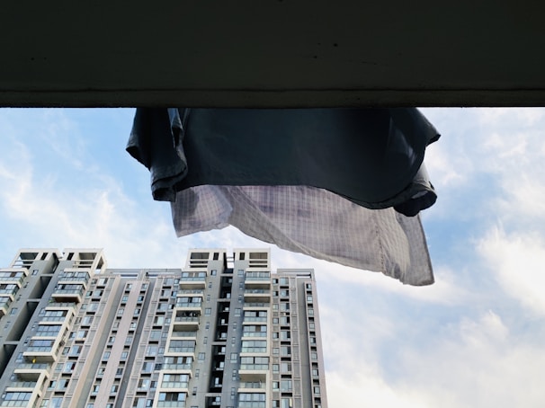 A candid shot of a Lumina Apparel shirt catching the breeze on a bustling city rooftop.