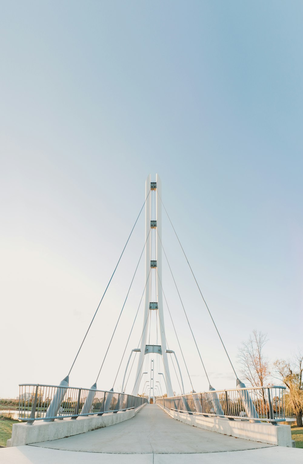 white and black electric tower under blue sky during daytime