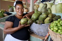 Local Dominican people smiling warmly in a colorful market setting.