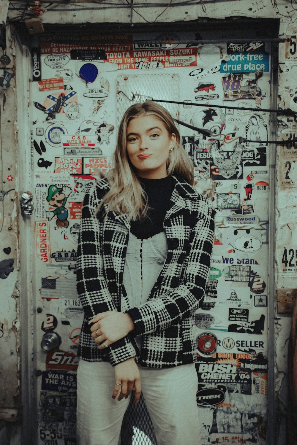 woman in black and white striped long sleeve shirt