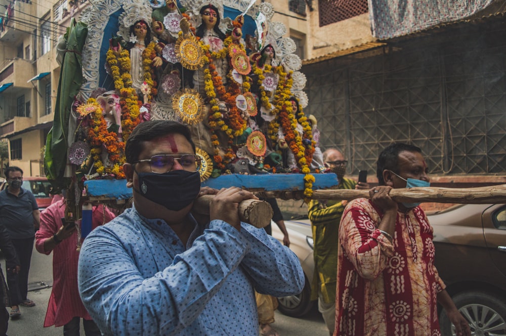 man in blue sweater wearing black sunglasses