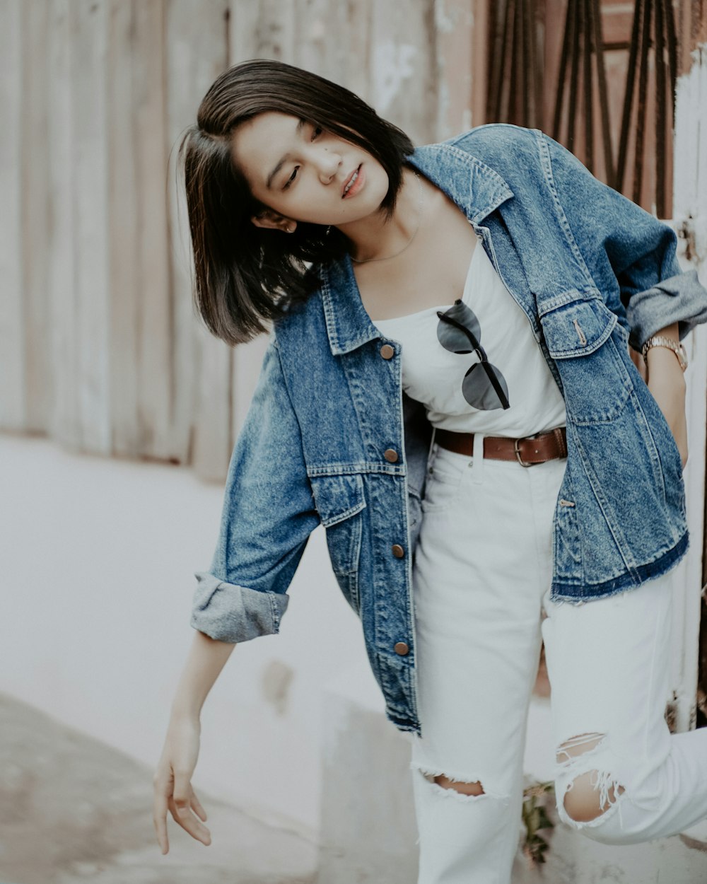 woman in blue denim jacket and white shirt