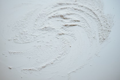 white snow on brown soil