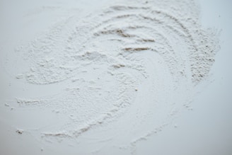 white snow on brown soil