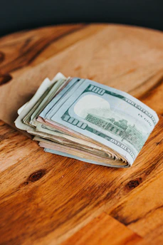 Image showing a stack of unpaid bills and credit cards on a table.