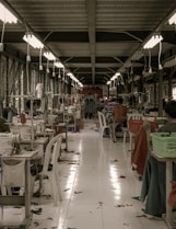 red and white dining tables and chairs in a t-shirt factory